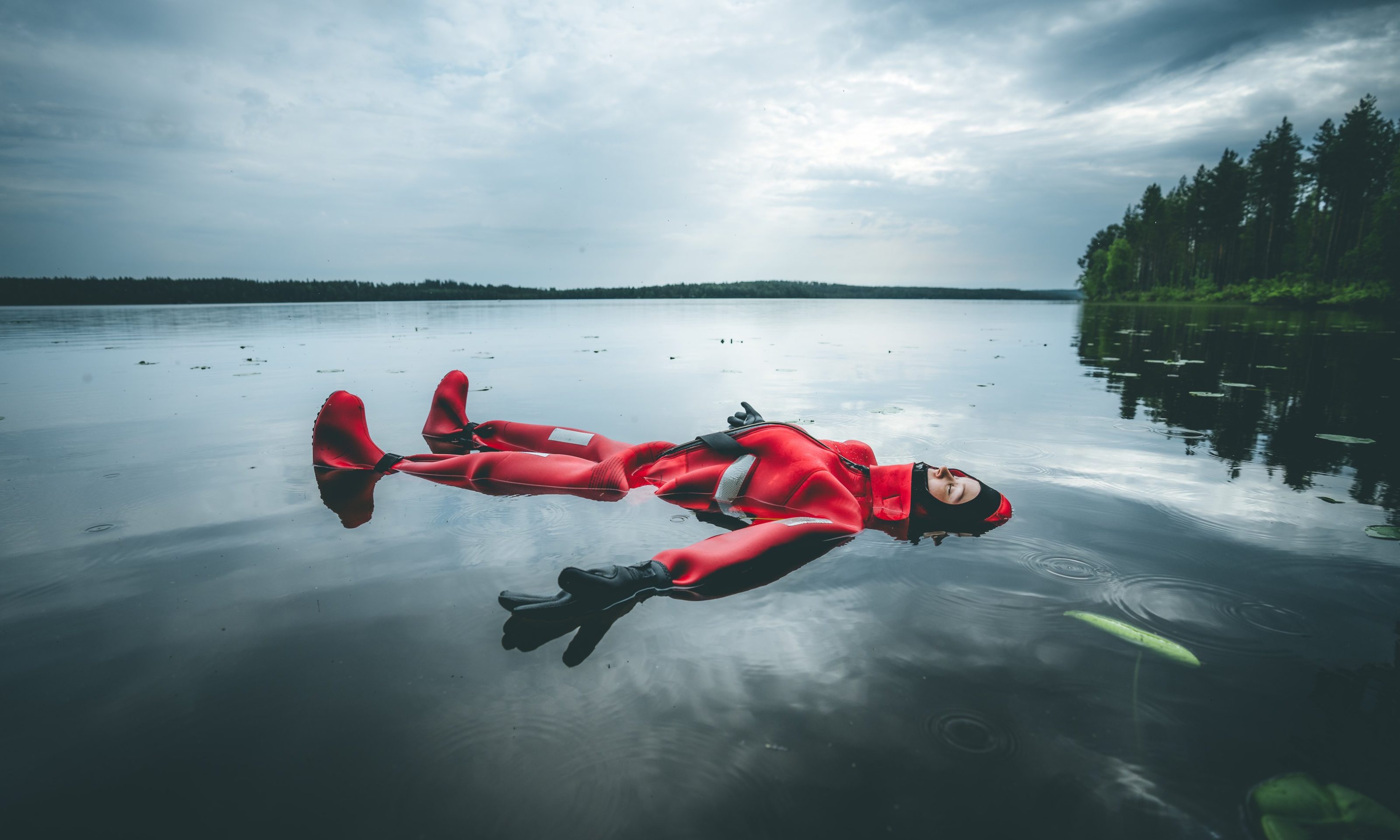 Guest floating in the lake in summer.