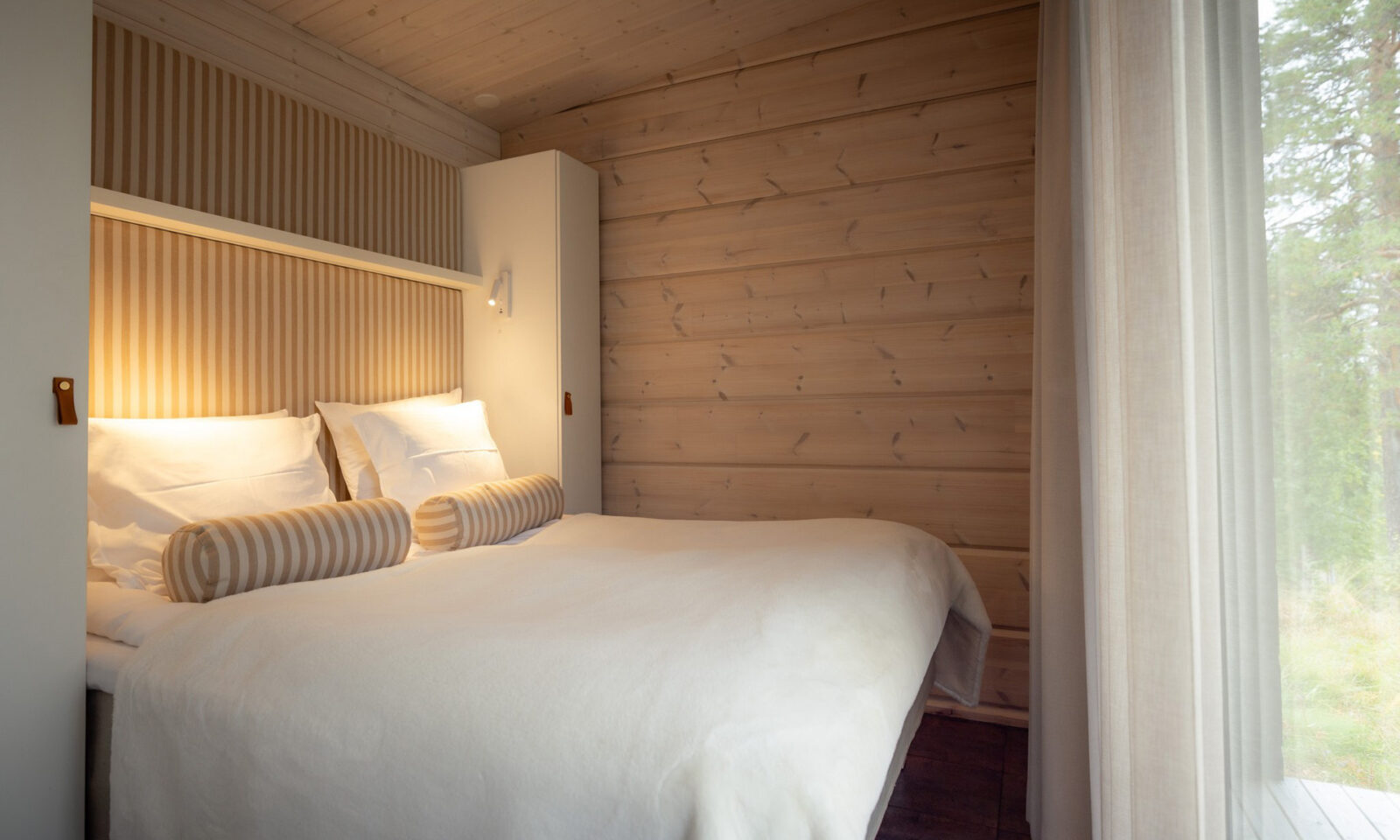 Bedroom of panoramic window in the Arctic GlassHouse Suite. | Arctic TreeHouse Hotel