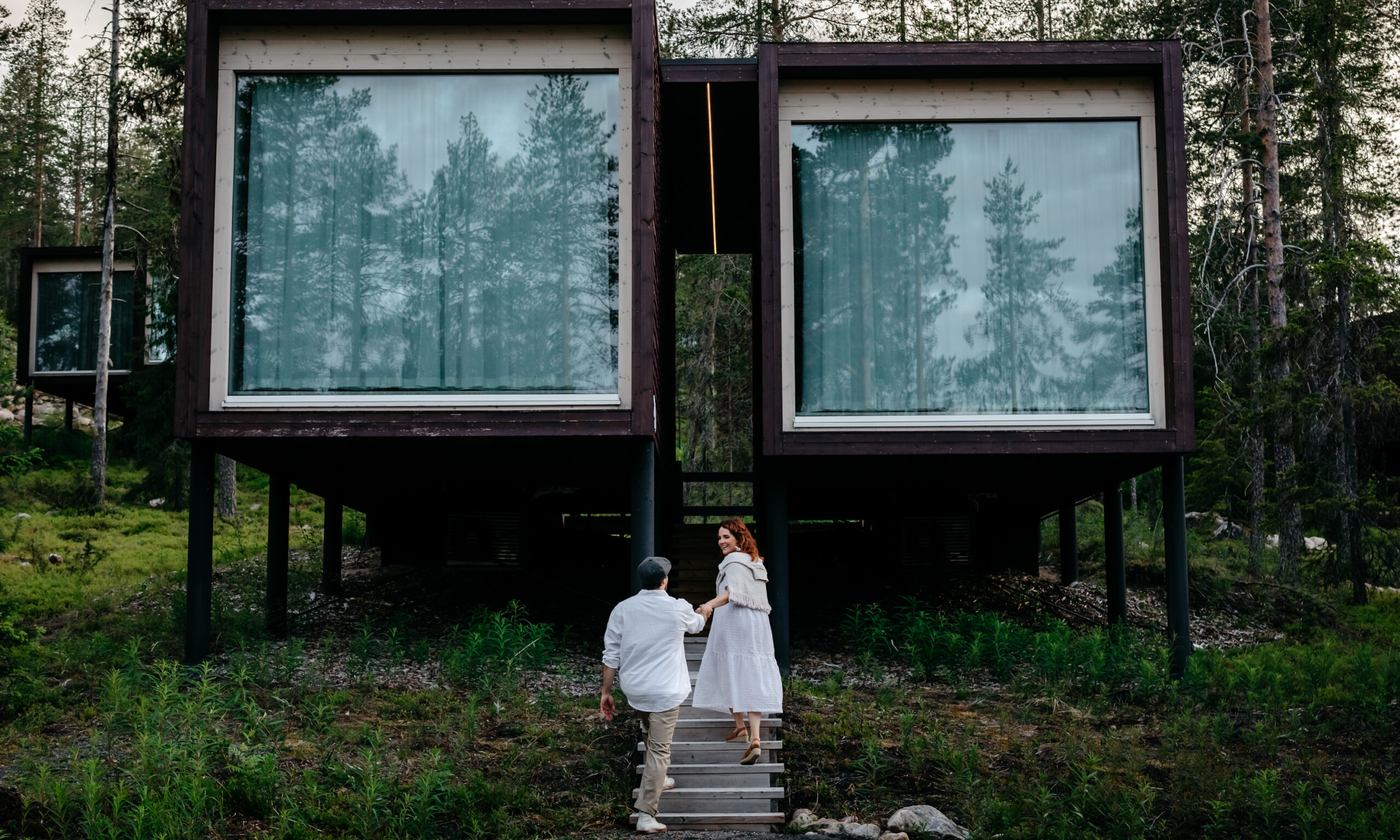 Couple climbing to the Arctic TreeHouse Suite.
